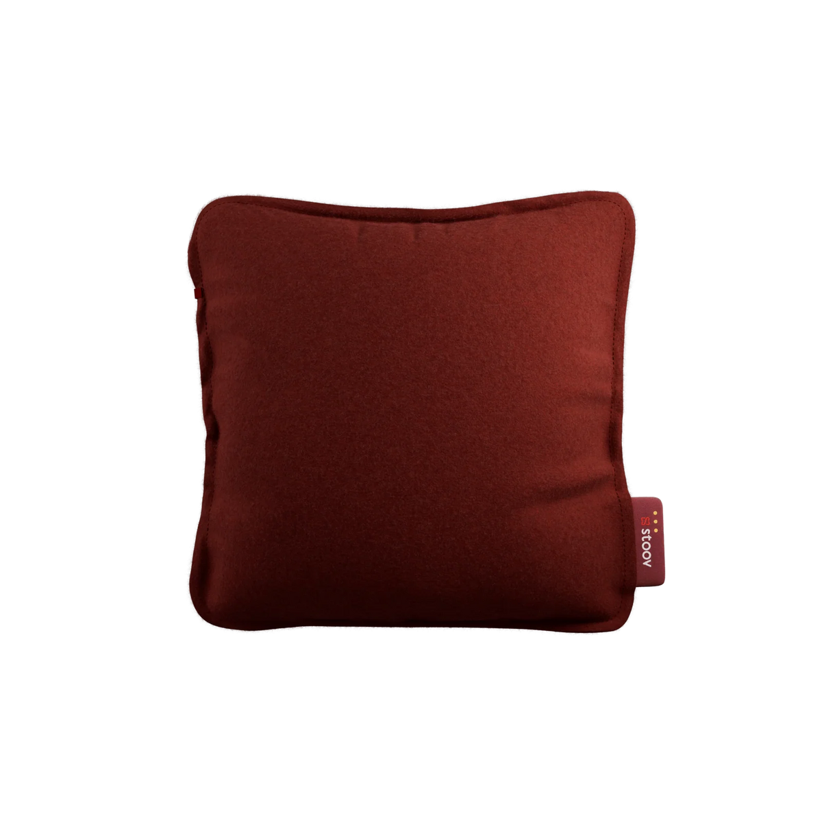 Stoov Ploov Flex oplaadbaar warmtekussen 45x45 cm, aardse rode kleur, zichtbaar met zacht textiel en bedieningsknoppen.