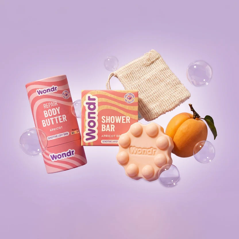Wondr giftbox met zachte verzorgingsproducten, kleine glow-inclusies en ontspannende huidverzorging in een stijlvolle verpakking.