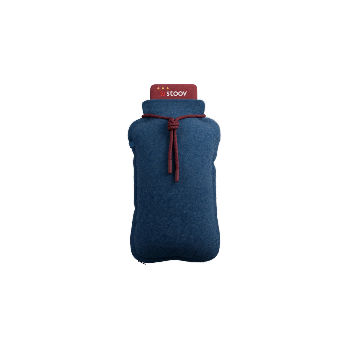 Stoov Homey Flex oplaadbaar warmtekussen in blauw, 25 x 35 cm, gelegen op een bed of bank, voor warmte en comfort.