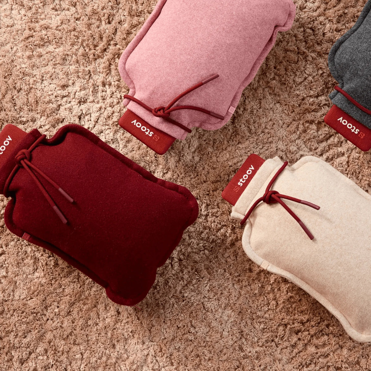 Stoov Homey Flex warmtekussen 25x35cm in zacht roze, ideaal voor comfortabel en warm ontspanning op kussens en dekens.
